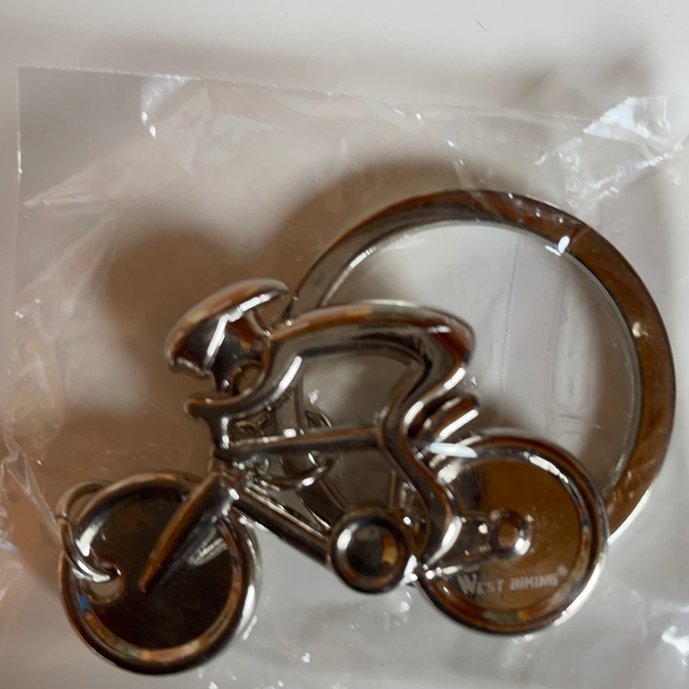 Metal biking key chain. New, never opened.